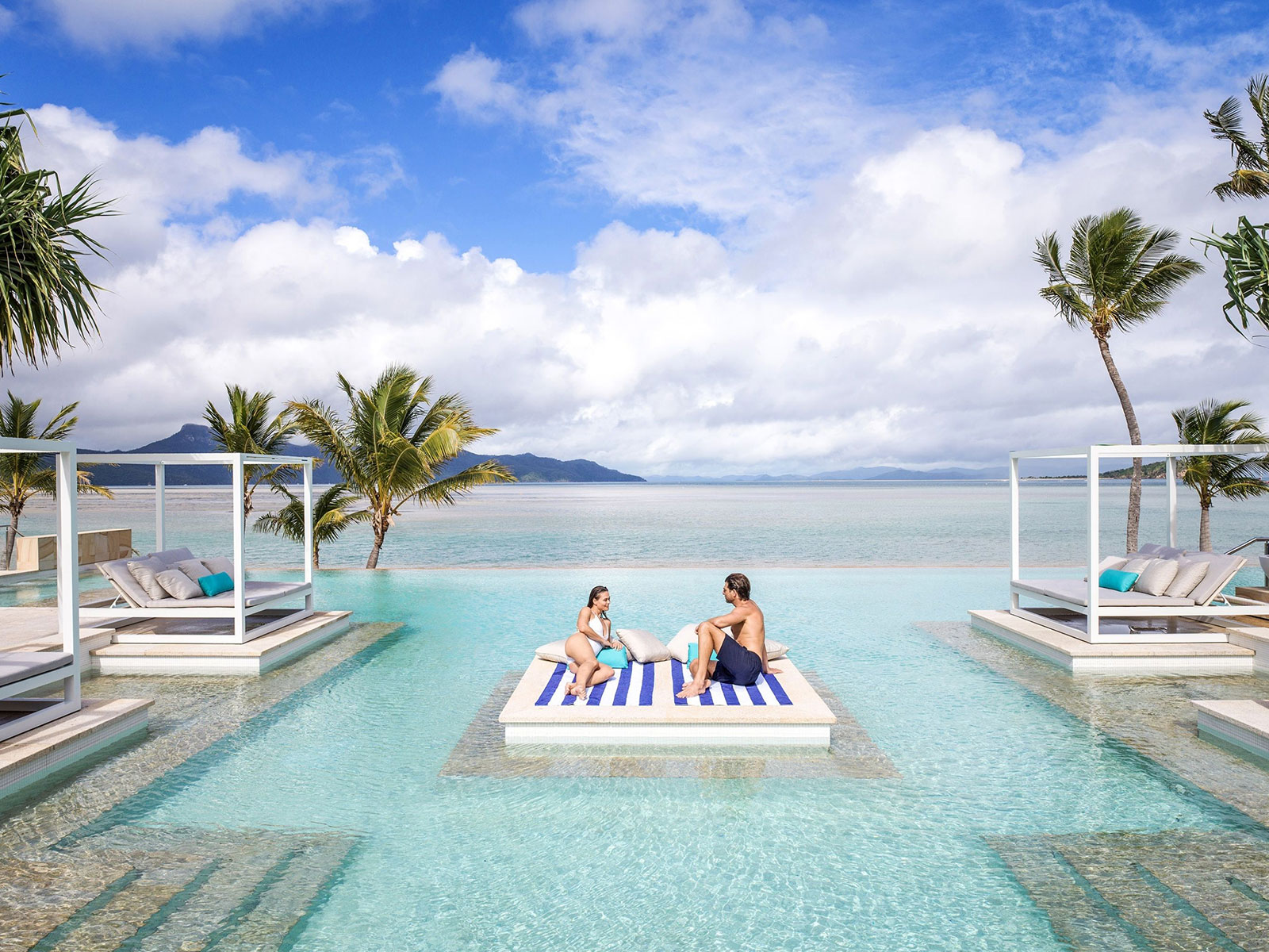 Women and man poolside at Intercontinental Hayman Island